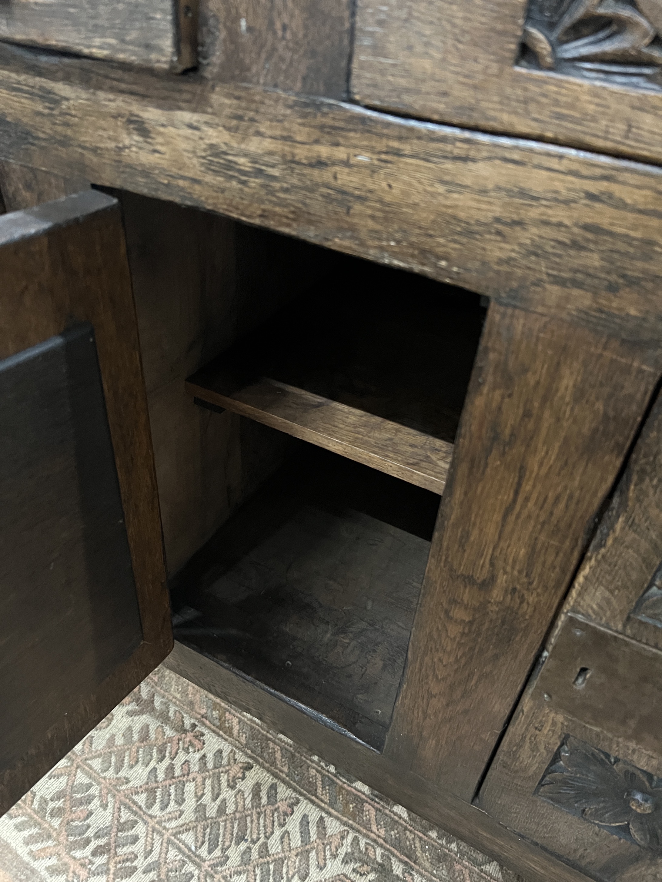 A 'Tudor Furniture' 17th century style carved oak dresser, width 146cm, depth 53cm, height 168cm
